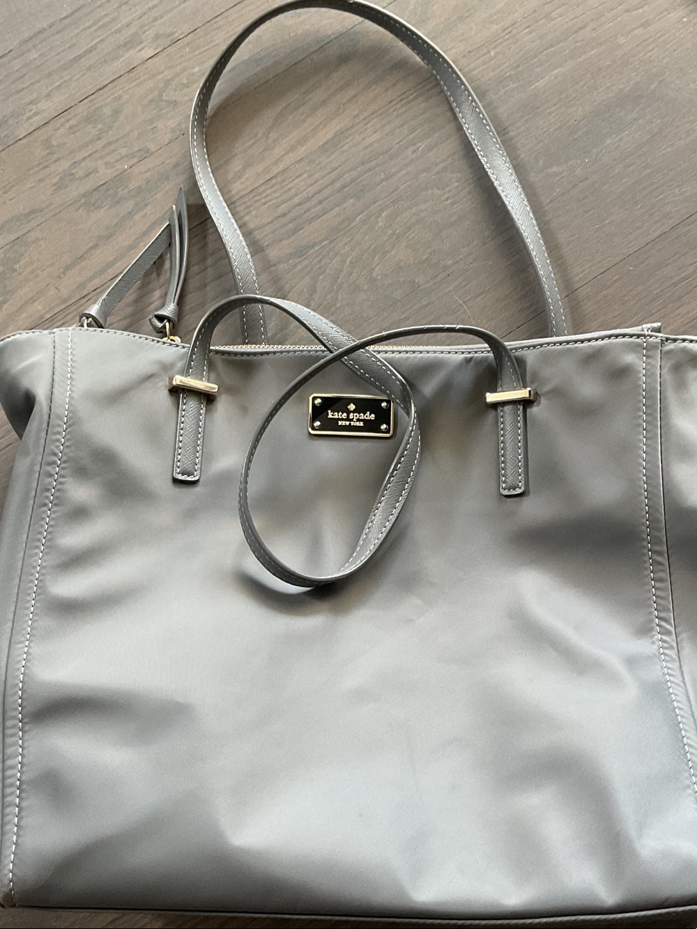 kate spade gray tote with gold logo plaque